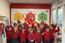 Headteacher Anna Archer with pupils at The Grove Infant and Nursery School, Harpenden.