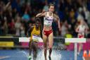 Lizzie Bird moves past Peruth Chemutai to take silver in the 3,000m Commonwealth Games steeplechase final.