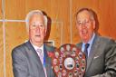 Harpenden Bowling Club's men's captain Roy Polley (right) receives the district league award from SADBA president Terry Atkinson.