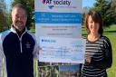 Captains Peter Hart and Cathy Gosling, from Harpenden Golf Club, present the donation to the AT Society.