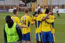 Jefferson Louis is mobbed after scoring his first St Albans City goal against Hungerford Town.