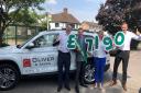 Macmillan volunteer Bradley Allen receiving the cheque for £7,190 from the Oliver & Akers team - owner Anthony Oliver, left, Wendy Morris and Jamie Mclver.
