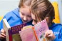 Harpenden Academy pupils Charlotte Watson, 7, and Saskia Greensmith, 6, will both benefit from the £5,000 library grant.