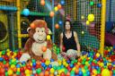 DJ's Jungle Adventure owner Helen Whittington and DJ the monkey celebrate the paly area reopening in the ball pit