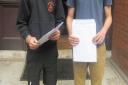 St Columba's College in St Albans has welcomed its GCSE results. Celebrating their marks are Sam Griffiths (left) and Thomas Griffith.