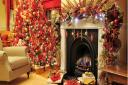 This display complements the red and cream interior of this home. There is a tree under there, somewhere