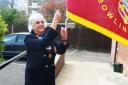 Harpenden president Denise Moores raises the club flag to signal the start of the 2023 bowls season. Picture: HARPENDEN BC