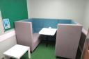 Furniture donated by Amthal, in a small meeting room.