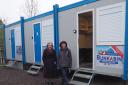 Volunteers Mary and Jackie beside the emergency accommodation