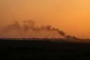 Smoke rises following an explosion in the Gaza Strip (Ohad Zwigenberg/AP)