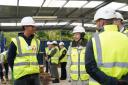 Corey Ratcliff (left), from Stevenage, meets the Princess Royal on a visit to the training hub where he is an apprentice bricklayer.