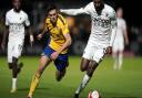St Albans City's Mitchell Weiss (left) and Boreham Wood's Jamal Fyfield battle for the ball during the Emirates FA Cup second round match at Meadow Park, Borehamwood, Hertfordshire.