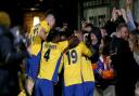 Mitchell Weiss is mobbed by team-mates after scoring the first goal for St Albans City on a historic night in the FA Cup against Forest Green Rovers.