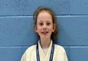 Emma Almond of Brookmans Park shows off her gold medal at the British Championships.
