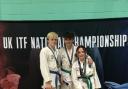 Joel Moss, Dylan Castillo and Zara Fitzgerald on the podium with their gold medals.