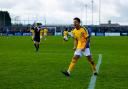 Zane Banton roars in celebration after scoring for St Albans City. Picture: SACFC