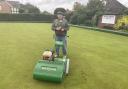Robbie Ransted with his mower and clubperson of the year trophy. Picture: TOWNSEND BOWLS CLUB