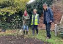 Deputy Mayor Cllr Josie Madoc planting in the Civic Rose Garden with Christine and David Graves