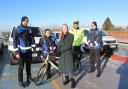 Councillor Helen Campbell (centre),  inspects the new all-electric fleet with Civil Enforcement Officers, (left to right) Alex, Daniela, Julius and Oskar