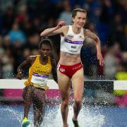 Lizzie Bird moves past Peruth Chemutai to take silver in the 3,000m Commonwealth Games steeplechase final.