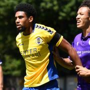 Mackye Townsend-West gets to grips with new team-mate Shaun Jeffers during St Albans City's friendly with Stevenage in July.