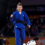 England’s Amy Platten (blue) celebrates after winning bronze at the 2022 Commonwealth Games.
