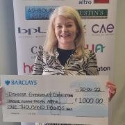Hertfordshire Chamber of Commerce CEO Briege Leahy with the £1,000 cheque for the Disasters Emergency Committee's Ukraine Humanitarian Appeal.
