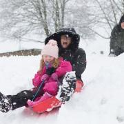 Jane Gill sledging with her four-year-old granddaughter Rosie in Hertfordshire, 2017.