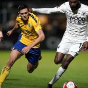 St Albans City's Mitchell Weiss (left) and Boreham Wood's Jamal Fyfield battle for the ball during the Emirates FA Cup second round match at Meadow Park, Borehamwood, Hertfordshire.