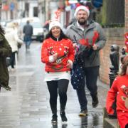 Olive sprints towards the Rudolph Run finish line ahead of her family