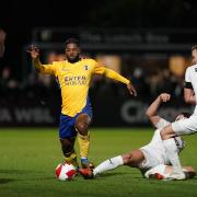 St Albans City's Kyran Wiltshire (centre) in action during the Emirates FA Cup second round match at Meadow Park, Borehamwood, Hertfordshire.