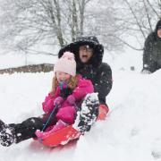 Jane Gill sledging with her four-year-old granddaughter Rosie. Picture: Margesson Photography