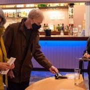 Paying by card at the bar at the Abbey Theatre in St Albans.