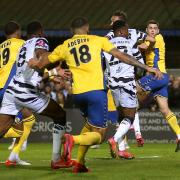 Mitchell Weiss (right) heads home St Albans City's first goal in their historic 3-2 win over Forest Green Rovers in the FA Cup.