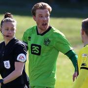 Referee Rebecca Welch speaks with Port Vale's Tom Conlon and Harrogate Town's Lloyd Kerry during the League Two match in April.