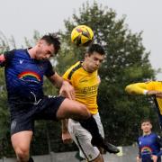 Mitchell Weiss goes for a header during St Albans City's draw with Met Police in the FA Cup.