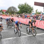 Wout van Aert (right) beats Julian Alaphilippe (left) and Ethan Hayter (centre) under the gaze of the Angel of the North in Gateshead.