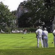 St Albans Bowling Club's picturesque green and clubhouse in Clarence Park.