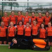 St Albans Hockey Club's Ladies' 2nds with coach Dick Ashby and mascot Darcy. 
Back row L-R: Dick Ashby, Hayley Payne, Lou Akers, Annie Barratt, Sarah Fretwell, Fiona Nekeman, Sim Burns, Joelle Weston, Emily Panniers. Middle row L-R: Darcy, Julie