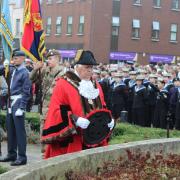 Mayor Geoff Harrison, laying a wreath at the St Albans War Memorial on St Peter's Street.