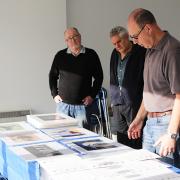 Members of the Carers’ Camera Club prepare for their third photography exhibition.