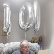 Frank Witton from St Albans reading his 100th birthday letter from the First Sea Lord