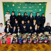 Pupils at How Wood Primary School with the gift bags