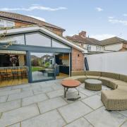 A landscaped rear garden, garden lodge and en-suite bedroom are all included.