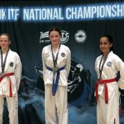 Zara Fitzgerald on the podium with her gold medal in sparring. Picture: HSV