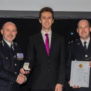 Tim Lewis (centre) received an award for bravery.