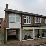 The shop would be constructed at the entrance to a car park next to the L.C. Weston funeral parlour.