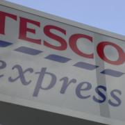 A man has been struck on the head with a wine bottle during an assault in a Tesco Express.