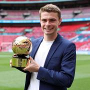 Former Harpenden Colt JJ Lacey with his golden ball award for being the FA Cup top scorer. Picture: GETTY IMAGES AND THE FA