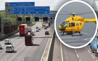 An air ambulance landed on the M25 between junctions 20 (Watford) and 21 (St Albans) after a woman suffered a 
